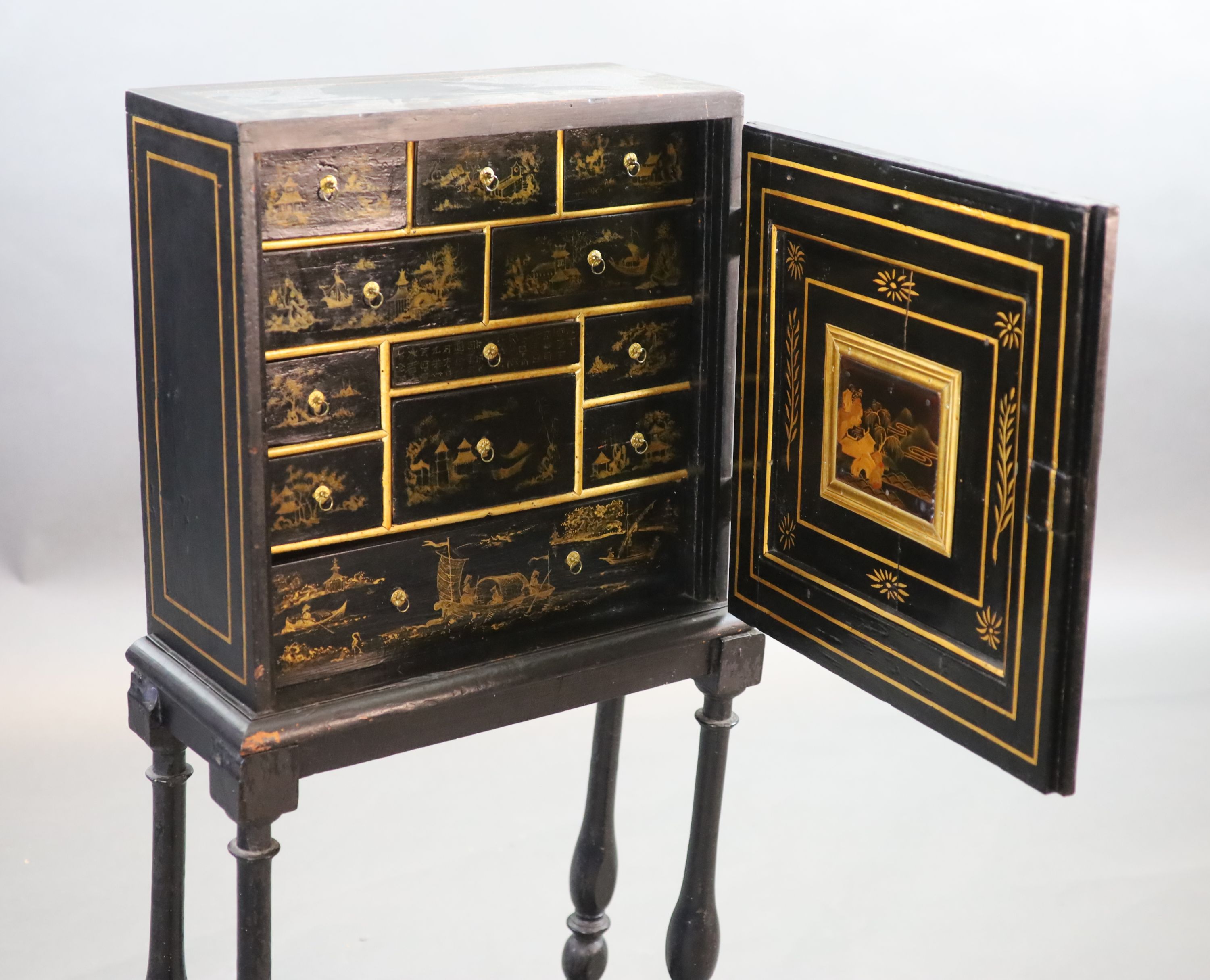 An early 18th century European japanned cabinet on stand, W.54cm D.24cm H.115.5cm